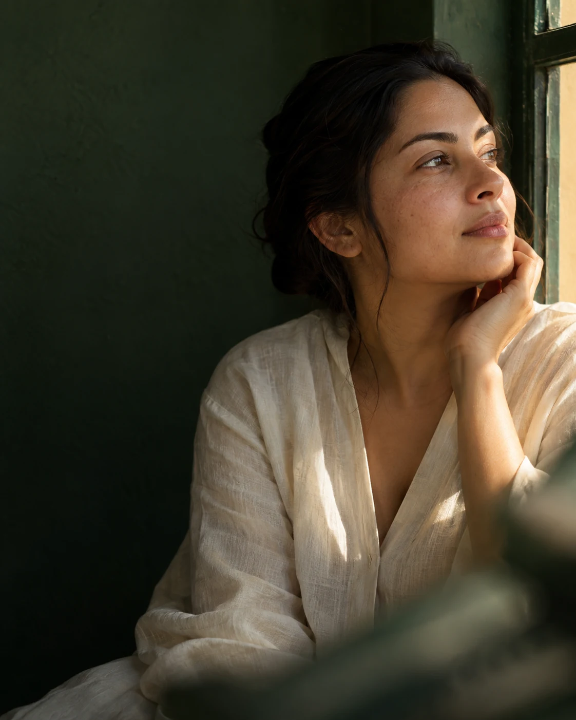 A quiet moment of self-care in warm window light